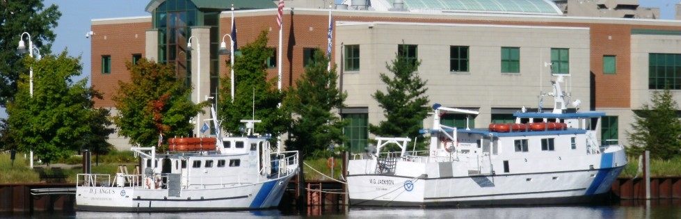 Two boats docked near Annis Water Resources Institute